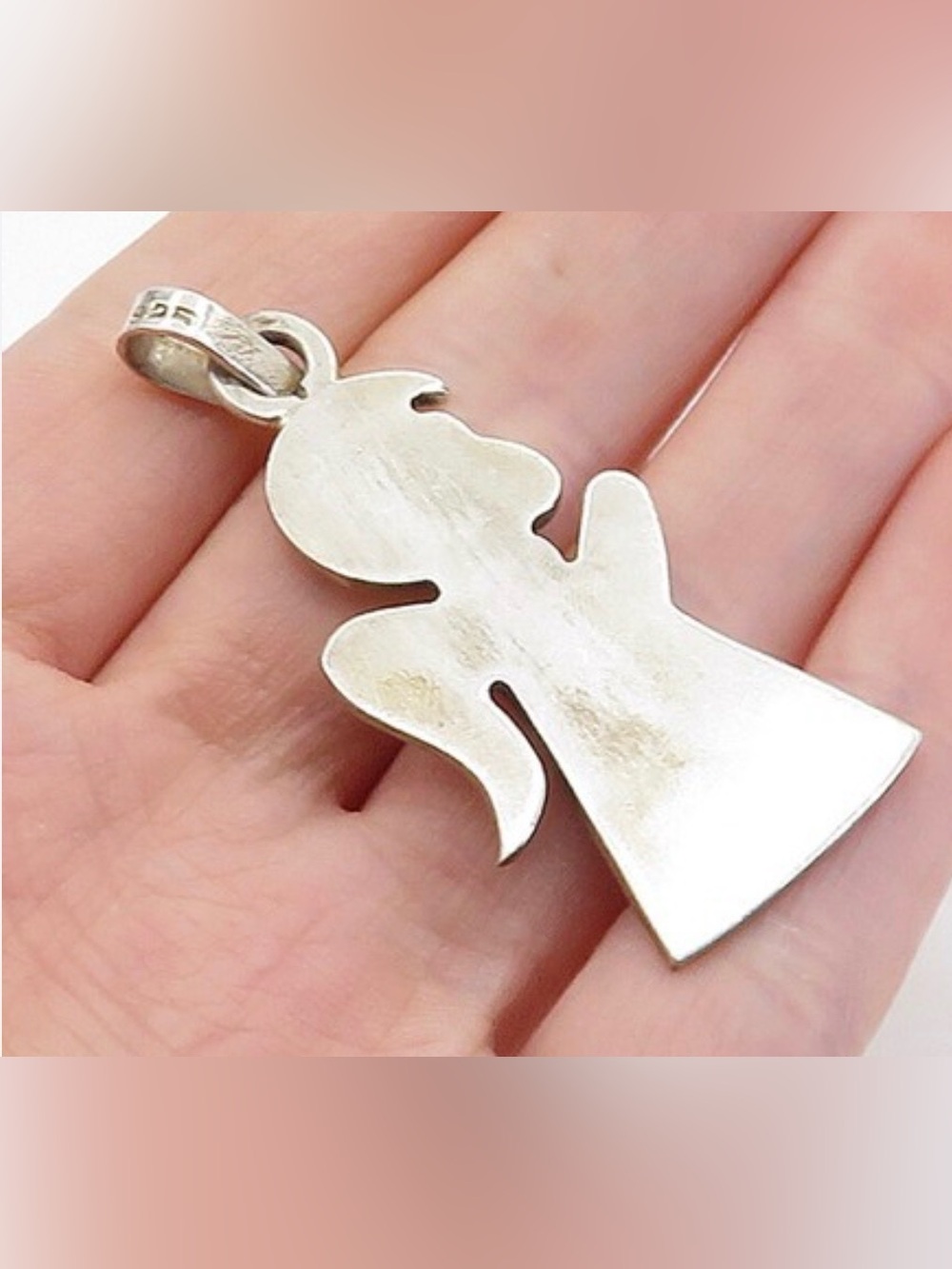 vintage-style angel pendant is crafted from 925 sterling silver